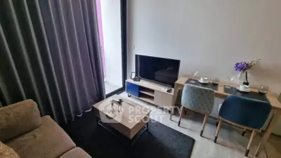 Modern living room with stylish furniture and balcony access, perfect for urban living.