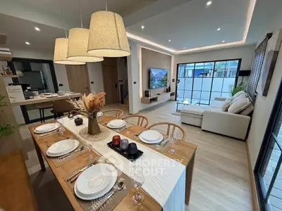Modern open-plan living and dining area with stylish decor and natural light.