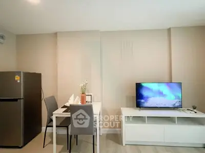 Modern living room with dining area and TV, featuring sleek furniture and neutral tones.
