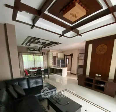 Modern living room with stylish ceiling design and open kitchen layout