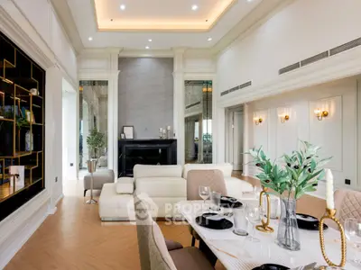 Luxurious living room with elegant dining area, featuring modern decor and ambient lighting.