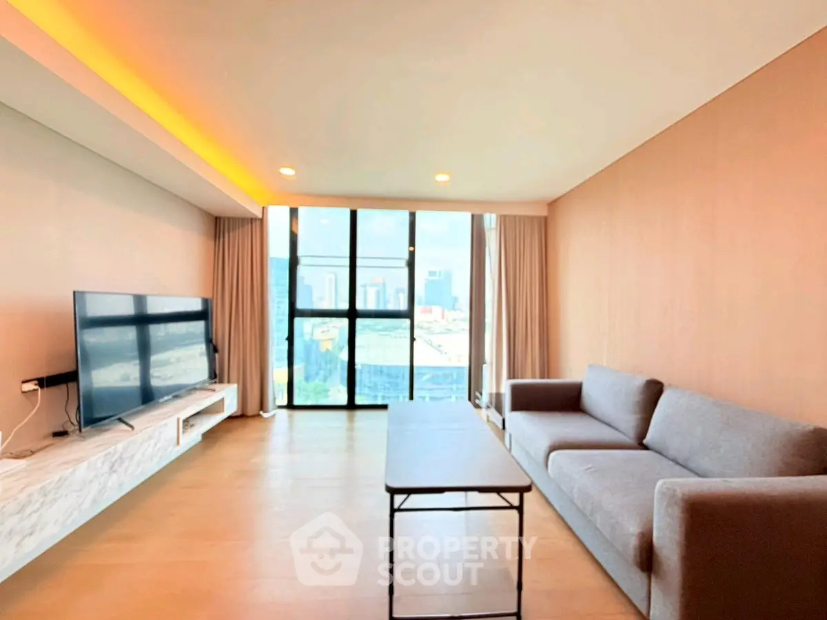 Spacious modern living room with large windows and city view