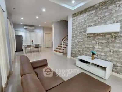 Modern living room with stylish decor and open dining area