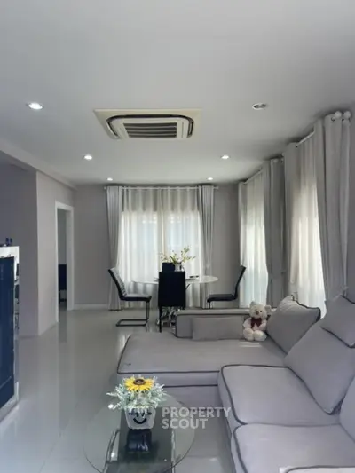 Modern living room with elegant decor and cozy seating area