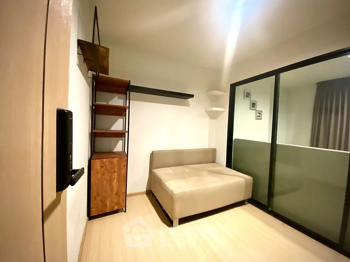 Cozy minimalist room with sofa bed and modern shelving
