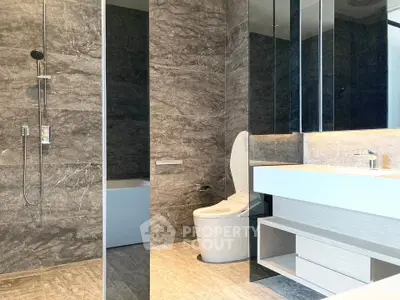 Luxurious modern bathroom with sleek marble tiles and elegant fixtures