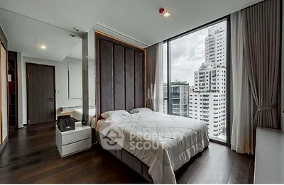Luxurious bedroom with floor-to-ceiling windows offering stunning city views in a modern high-rise apartment.