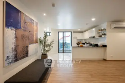 Spacious modern living room with open kitchen and stylish decor
