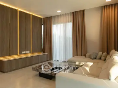 Luxurious modern living room with elegant lighting and plush seating