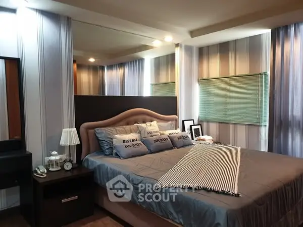 Luxurious bedroom with stylish decor and cozy ambiance, perfect for relaxation.
