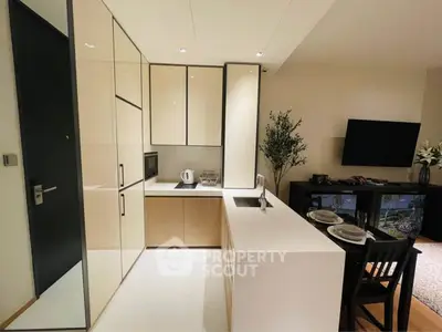 Modern kitchen with sleek cabinetry and open layout in stylish apartment