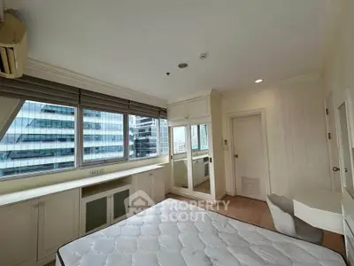 Spacious bedroom with city view and ample natural light