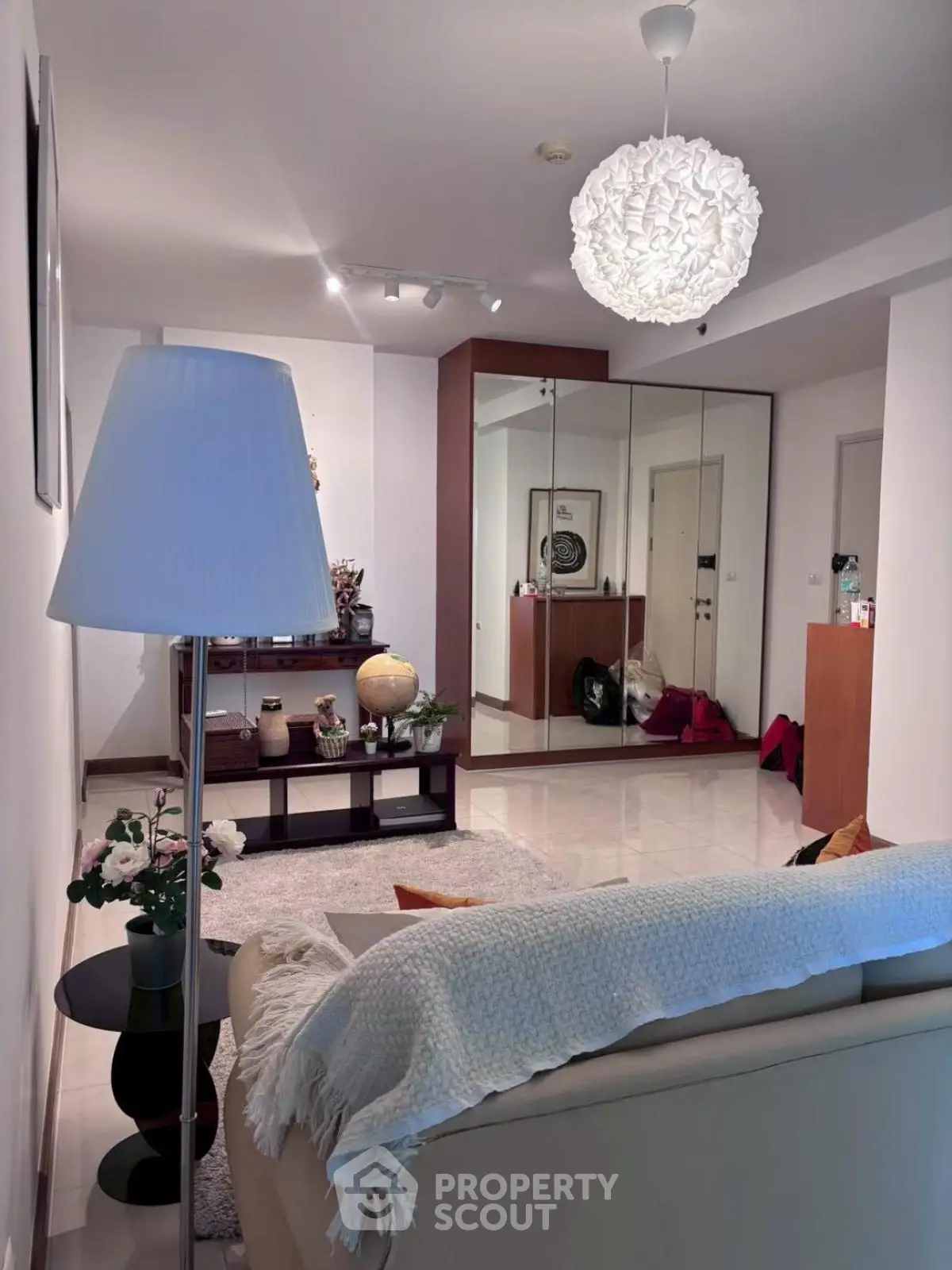 Stylish living room with modern decor and elegant lighting, perfect for relaxation and entertaining.