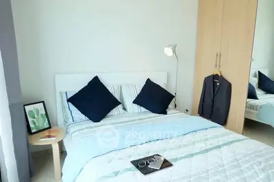 Cozy bedroom with modern decor and ample natural light