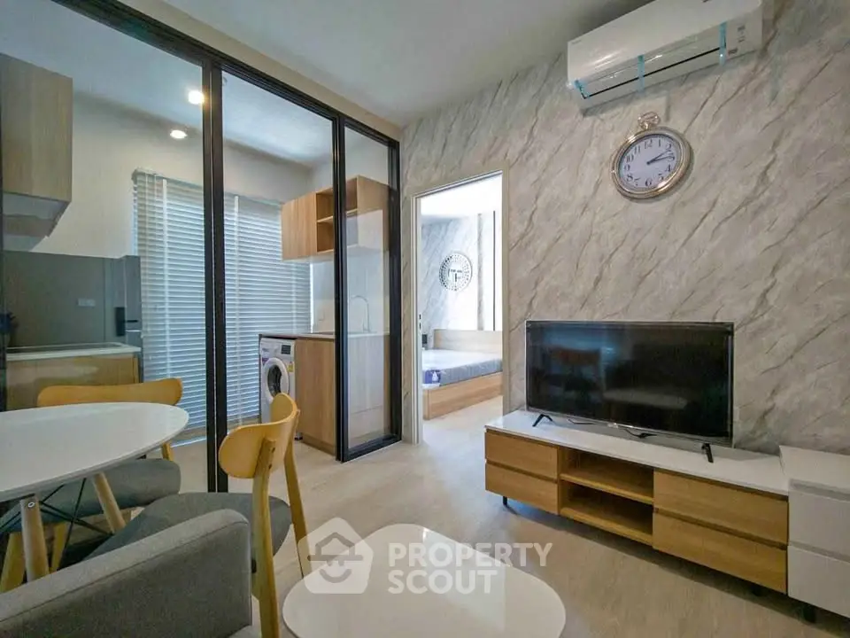 Modern living room with open kitchen and stylish decor