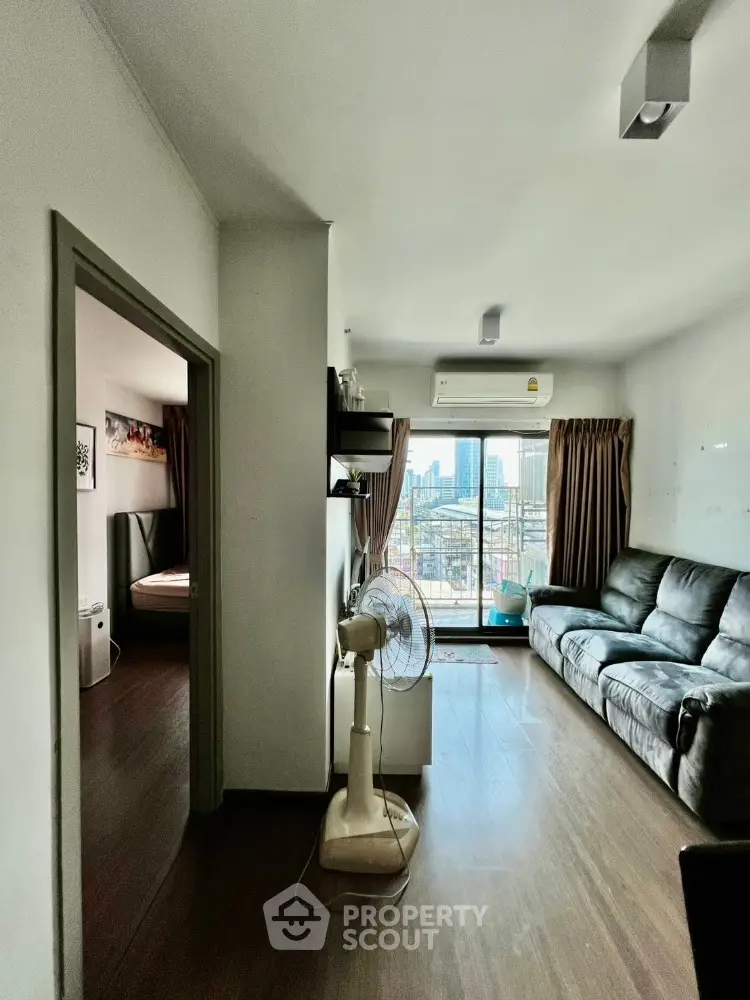 Modern apartment living room with balcony and city view