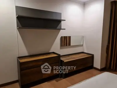 Modern bedroom with sleek wooden furniture and minimalist design