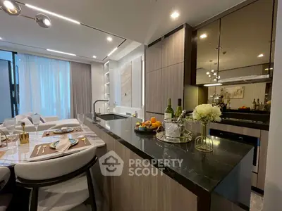 Luxurious open kitchen with modern dining area and elegant decor