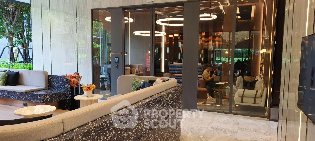 Luxurious modern living room with elegant seating and stylish lighting in a high-end property.