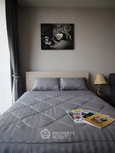 Cozy bedroom with stylish decor and comfortable bedding in modern apartment.