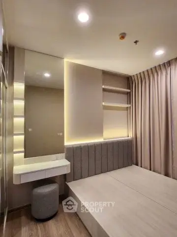 Modern bedroom with sleek design, built-in shelves, and ambient lighting for a cozy atmosphere.
