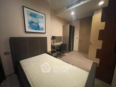 Modern bedroom with stylish decor and comfortable single bed in a contemporary apartment.