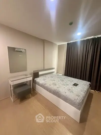 Modern bedroom with stylish furniture and cozy ambiance, featuring a comfortable bed and elegant decor.
