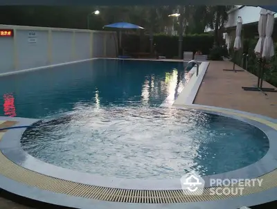 Luxurious swimming pool with jacuzzi in modern residential complex