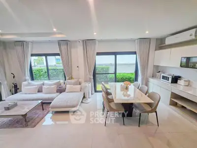 Spacious modern living room with elegant dining area and large windows