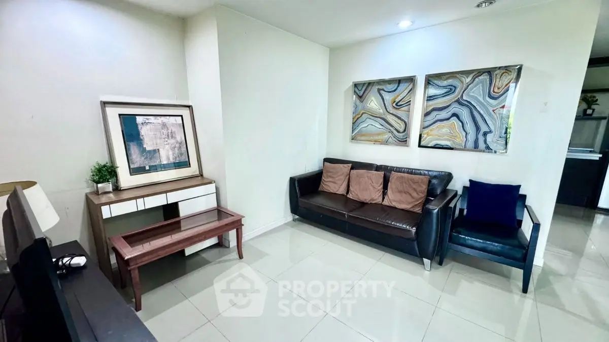 Stylish living room with modern decor and comfortable seating in a contemporary apartment.
