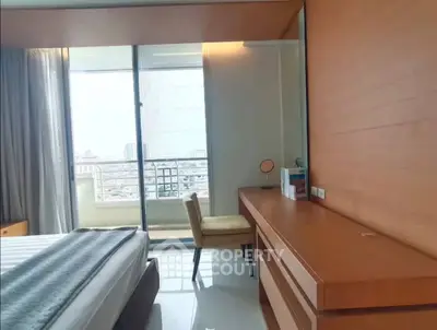 Modern bedroom with balcony view and stylish wooden furniture