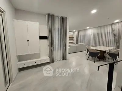Spacious modern living room with elegant dining area and stylish furniture