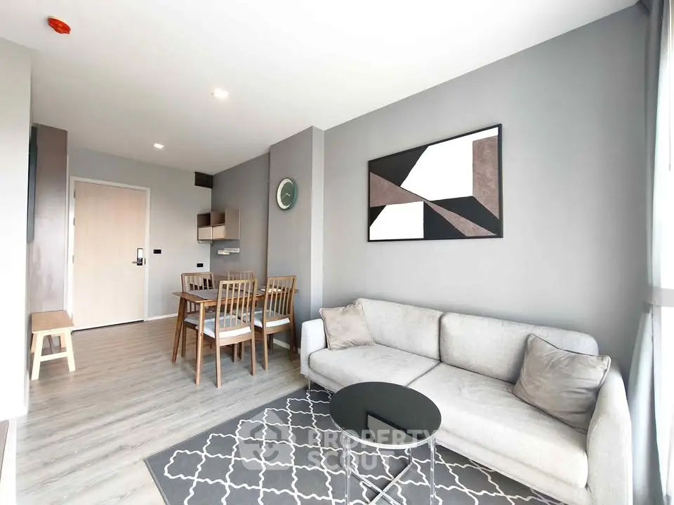 Modern living room with stylish decor and dining area in open layout apartment.