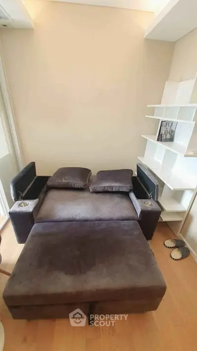 Cozy living room with modern sofa bed and stylish shelving unit