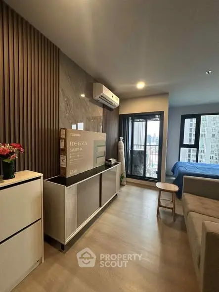 Modern apartment interior with open layout and balcony view