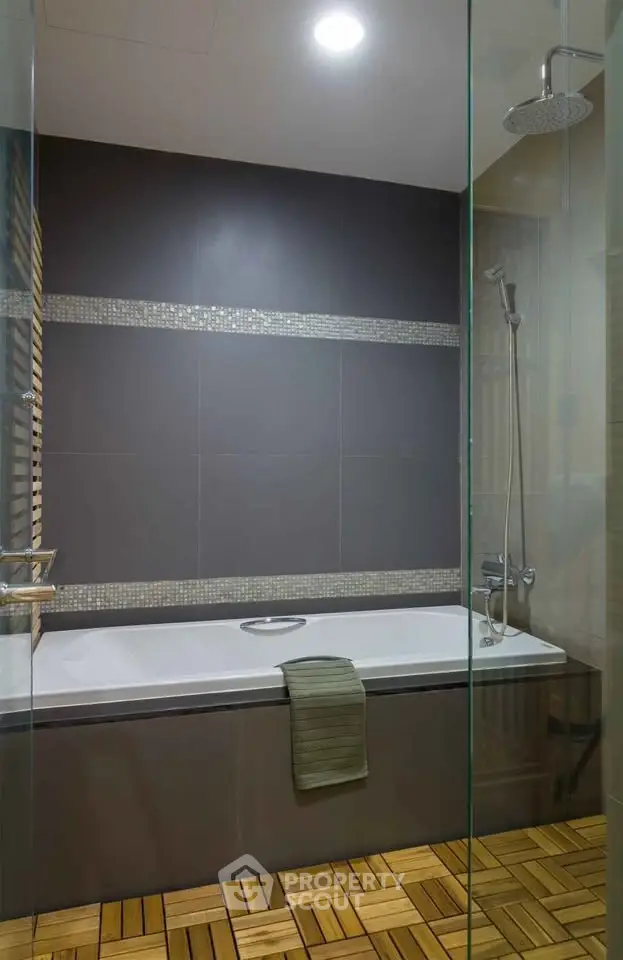 Modern bathroom with sleek bathtub and rainfall showerhead