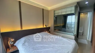 Modern bedroom with city view and ensuite bathroom in luxury apartment