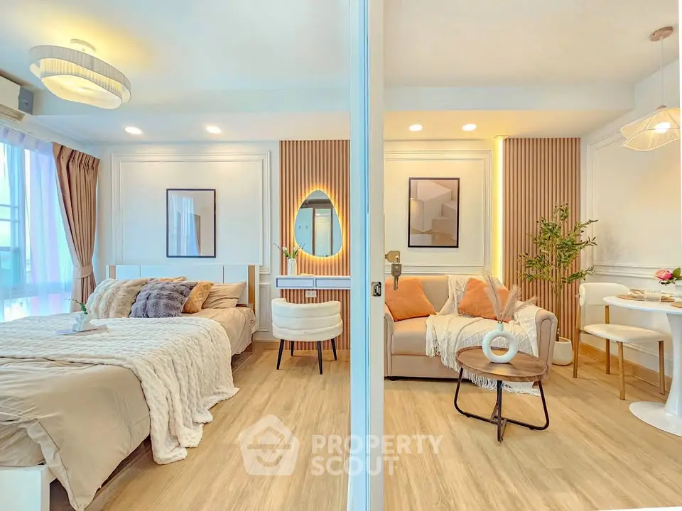 Luxurious open-plan living room and bedroom with modern decor and cozy ambiance