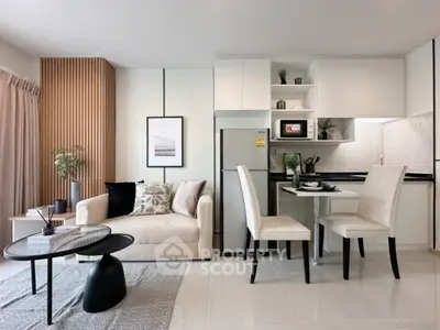 Modern open-plan living room and kitchen with stylish decor and neutral tones