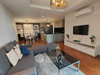 Spacious modern living room with open kitchen and elegant decor