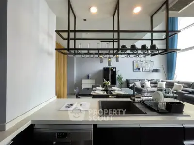 Modern open-layout kitchen with sleek design and spacious living area