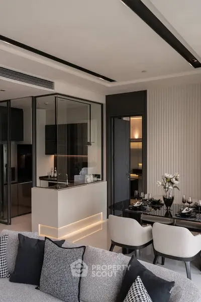 Luxurious modern living room with open kitchen and elegant dining area, featuring sleek design and ambient lighting.