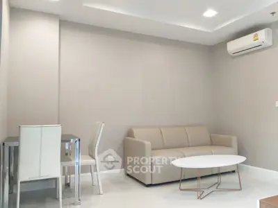 Modern living room with sleek furniture and air conditioning
