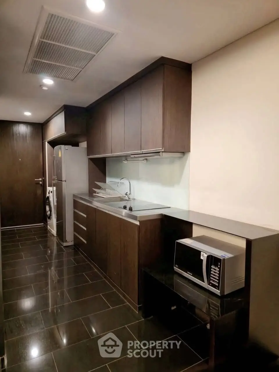 Modern kitchen with sleek cabinetry and stainless steel appliances