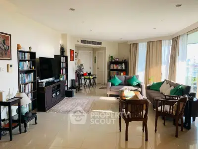 Spacious and bright living room with modern decor and large windows