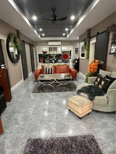 Luxurious modern living room with stylish furniture and elegant decor, perfect for relaxation and entertainment.