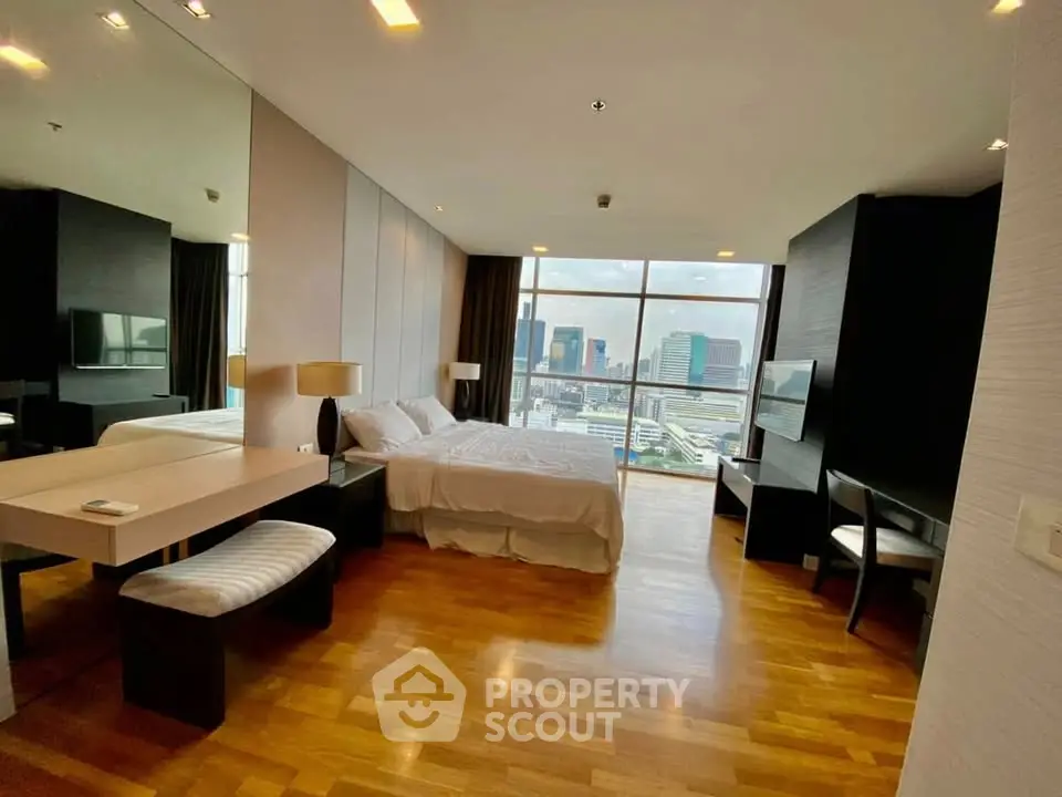 Luxurious bedroom with stunning city view and modern furnishings