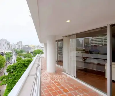 Spacious balcony with city view in modern apartment building