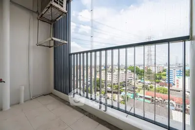 Spacious balcony with city view, perfect for relaxation and enjoying the skyline.