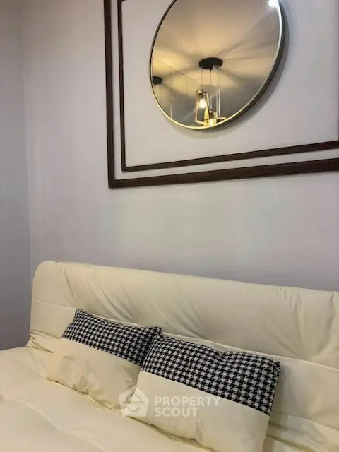 Cozy bedroom with stylish decor and elegant lighting